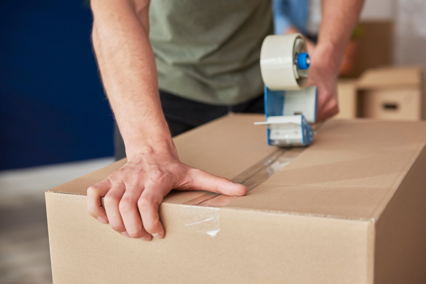 Man Packing Boxes at Home