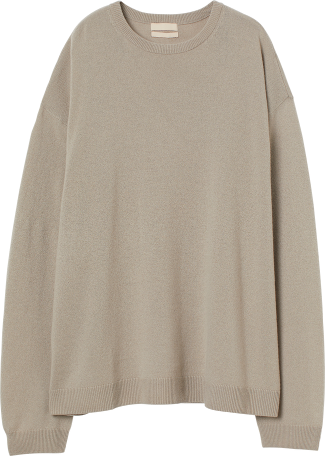 Front view of isolated light brown woman casual sweater